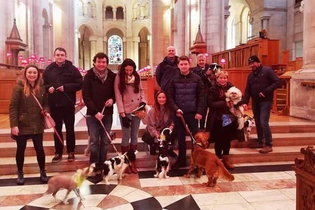 News Letter reporter Kathryn McKenna with her dog Dougal on the Belfast food tour in St Anne's Cathedral
