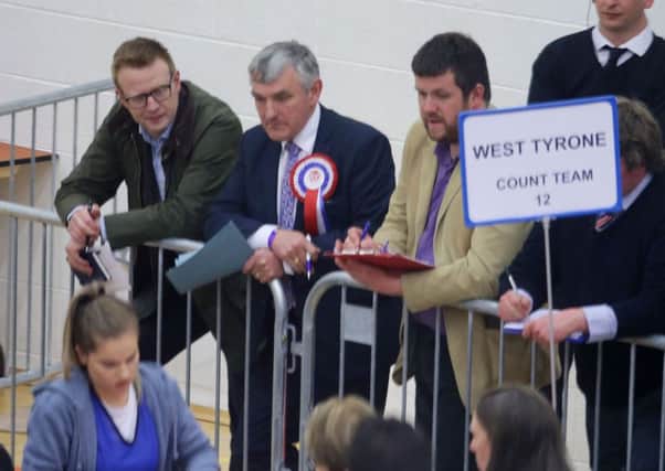Tom Buchanan, centre, during Thursday night's election county in West Tyrone