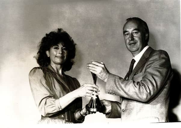 Archie Reid rceives the 'Ten Best Award' from British film star, Nanette Newman in 1972
