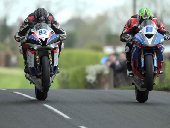 Racing at the Tandragee 100 was delayed for two hours following a four-rider crash on Saturday.