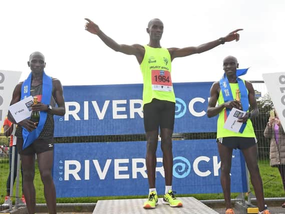 Eric Koech stands tall as number one on the Belfast City Marathon rostrum