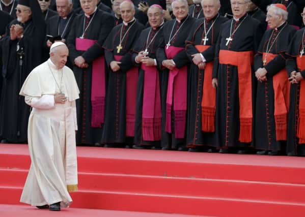 Pope Francis walks past cardinals and bishops in the Tor Vergata neighborhood in Rome today, Saturday, May 5, 2018, on the occasion of the 50th anniversary of the Neocatechumenal Way, one of the Catholic Church's biggest missionary movement. Protestant church leaders in Northern Ireland have urged him to visit the Province. (AP Photo/Andrew Medichini)