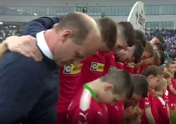 Still from BBC footage showing Cliftonville team protesting the playing of the national anthem at the Irish Cup final, 05-05-18