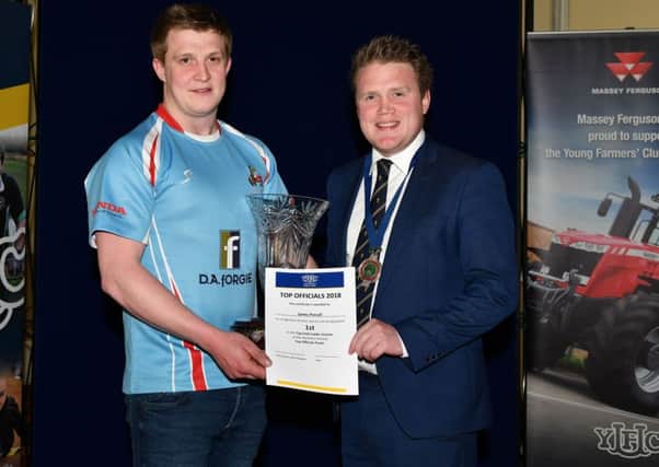 James Purcell from Dungiven YFC who was awarded top club leader is pictured with YFCU president James Speers