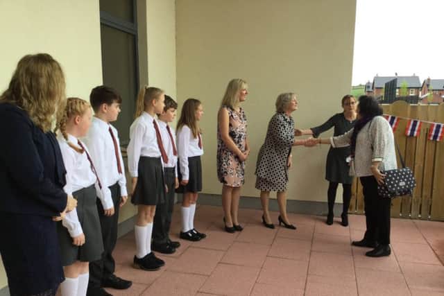 Principal Linda Allen was accompanied by staff and pupils as she welcomed Miss Chintana Watcharakul, Director of Intercountry Adoptions, and her colleagues to Dromore Central Primary School.