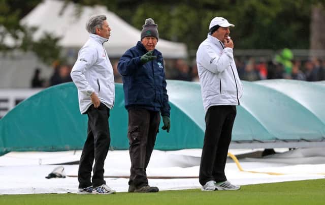 Umpires and ground-staff inspect the wicket on day one of the International Test Match at The Village, Dublin. PRESS ASSOCIATION Photo.  Donall Farmer/PA Wire.