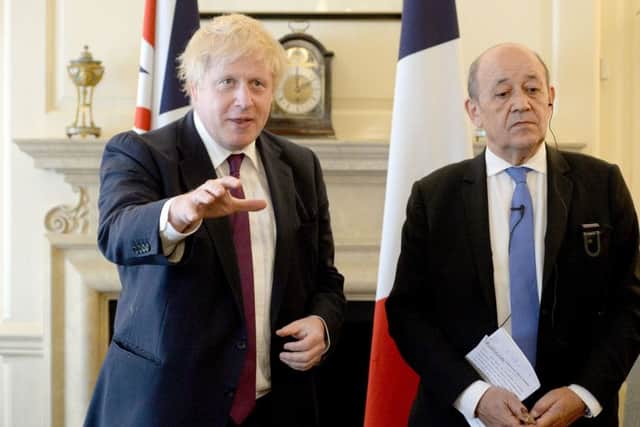 Foreign Secretary Boris Johnson, above with French Foreign Minister Jean-Yves Le Drian in London on Monday May 14, is still in post as Foreign Secretary after describing the prime minister Theresa May's customs union plan as crazy. Photo: Kirsty O'Connor/PA Wire