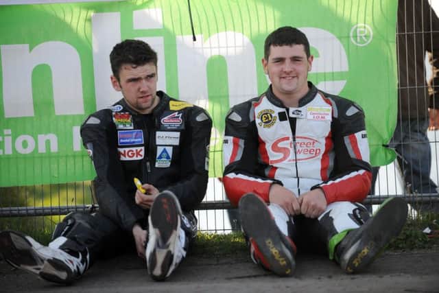 Robert Dunlop's sons William and Michael pictured before the start of practice at the North West 200 in 2008