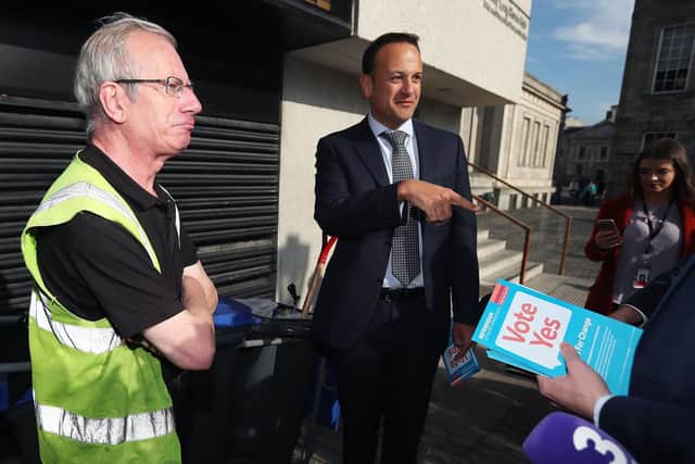 n Taoiseach Leo Varadkar speaks with Edward O'Sullivan, Estates and Facilities, on the grounds of Trinity College Dublin, following a commuter canvass at Tara street station, Dublin, by Fine Gael members supporting repeal of the 8th Amendment of the Irish Constitution which is to be decided on in a referendum on May 25th