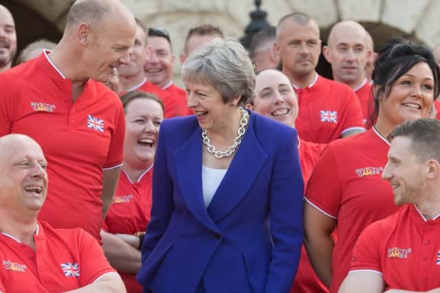 Prime Minister Theresa May with the UK team yesterday ahead of the Invictus Games Sydney 2018 at Horse Guards Parade in London