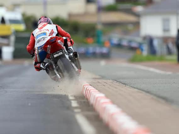 Lee Johnston kicks up a cloud of dust and stones on the exit of the start and finish chicane on the Honda Racing Fireblade.