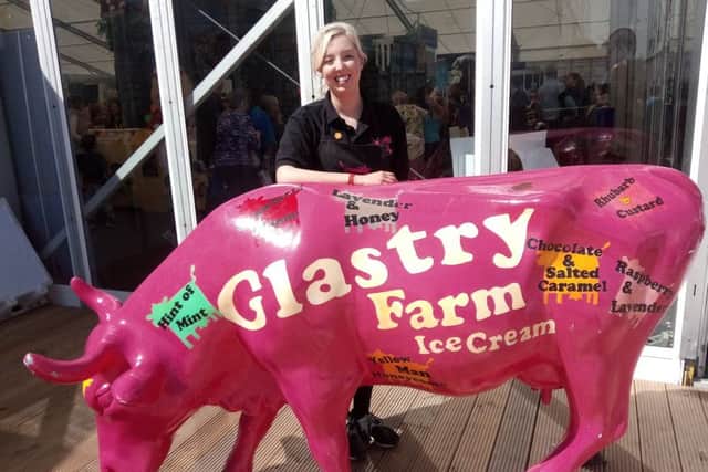 Chloe Burgess at Balmoral Show with the Glastry Farm cow  known as Gloria Honeycomb