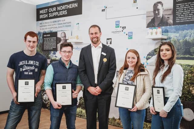 Students from CAFRE Greenmount accepting their award from Peter Kennedy, M&S Agriculture Manager