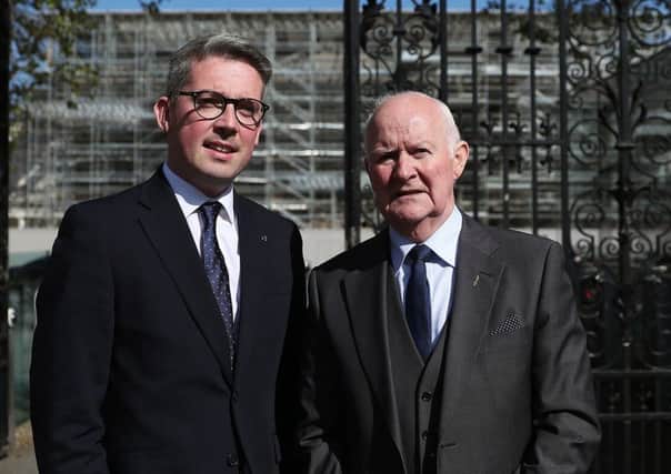 Sinn Fein senator Niall O Donnghaile (left) with Liam Shannon, one of the Hooded Men, outside Leinster House, Dublin on Wednesday