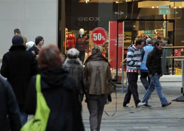 Shoppers in Belfast city centre seek out some bargins in the sales