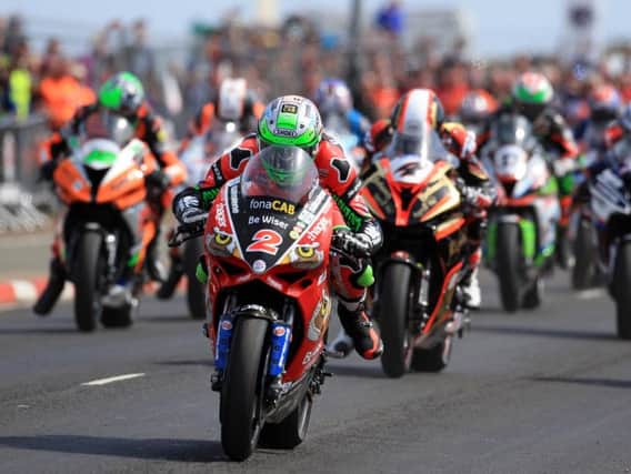Glenn Irwin powers off the line on the PBM Be Wiser Ducati at the North West 200.