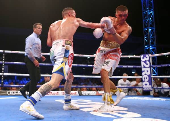 Lee Selby (right) in action against Josh Warrington during their IBF World Featherweight bout at Elland Road