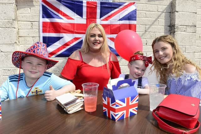 A street party was held on the Shankill Road in Belfast to celebrate the wedding. Pictured are Kirsty McClure, Zara, Adam and Leanne Fleck