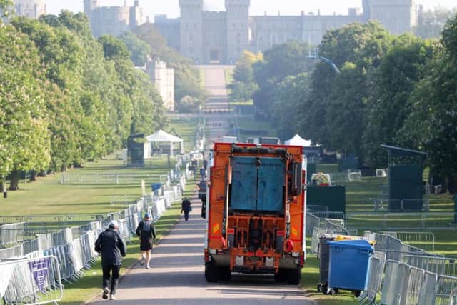 A bin lorry makes its way down the Long Walk in Windsor, as the clean-up continues after the royal wedding