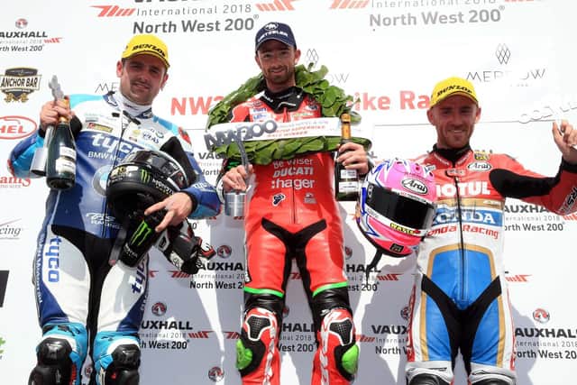 Tyco BMW rider Michael Dunlop on the podium with race winner Glenn Irwin and Lee Johnston, who finished third.
