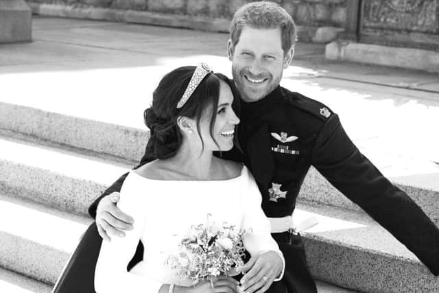 This official wedding photograph released by the Duke and Duchess of Sussex shows the Duke and Duchess pictured together on the East Terrace of Windsor Castle