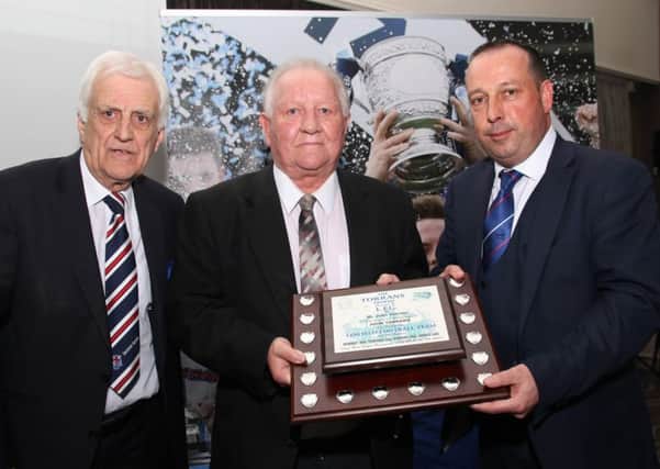 Billy Kennedy (left) and Sammy Pavis who were honoured by Linfield FC. Also pictured is Blues chairman, Roy McGivern