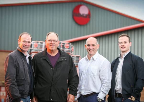 US customer, David Liefer, second left, pictured in Dromore with, from left, Phillip Orr, Gary McDonald and Harry Orr from UPU
