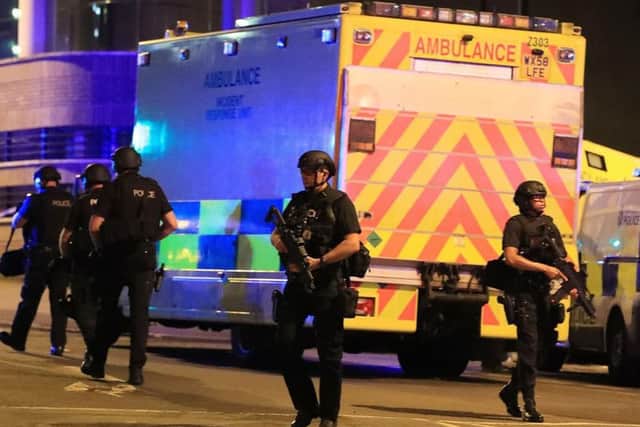 Armed police on the ground outside the Manchester Arena