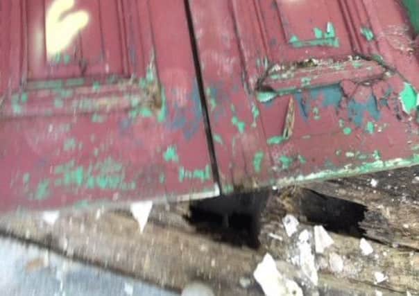 Victoria door vandalised at  R4 in Tavanagh Industrial Estate. It fell so heavily in smashed floor boards