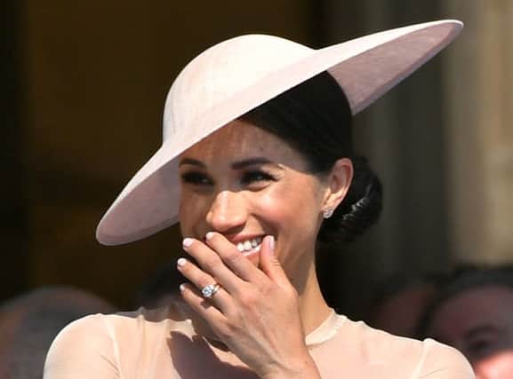 The Duchess of Sussex at a garden party at Buckingham Palace in London which she is attending as her first royal engagement after being married