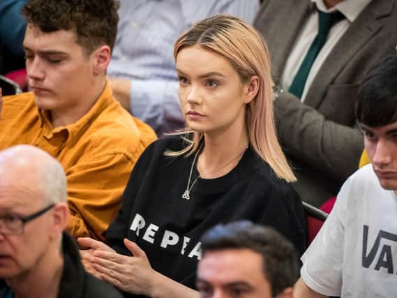 A campaigner to the 8th amendment to the Irish Constitution wears a REPEAL t-shirt during Labour leader Jeremy Corbyn's lecture at Whitla Hall at Queens University in Belfast