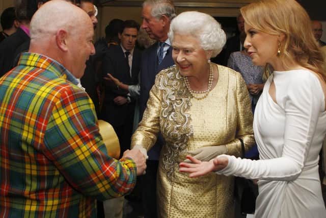 Queen Elizabeth II meets Madness and Kylie Minogue backstage at The Diamond Jubilee Concert outside Buckingham Palace, London