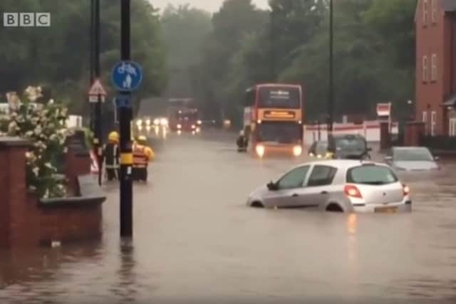BBC image of floods in Birmingham after downpours on Sunday. A man has died after storms caused the flash flooding across the West Midlands as more than a month's rainfall deluged parts of Birmingham in just one hour