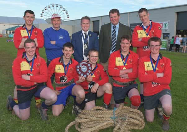Winners of the 2018 advanced tug of war competition, Derg Valley YFC, pictured with Philip Donaldson from sponsor John Thompson and Sons Ltd and YFCU president James Speers