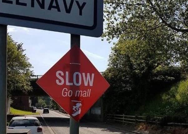 A number of signs carrying road safety messages in English and Irish, and the Sinn Fein logo, have been erected in Glenavy.