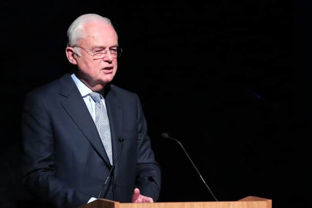 Sir Martyn Lewis CBE, chairman of the QAVS awards committee speaking in the Theatre in the Mill