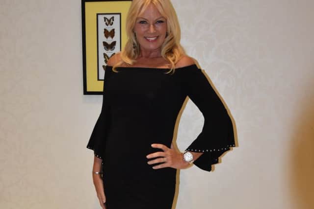 Alison Clarke is pictured in a stunning black dress from Couples in Coleraine