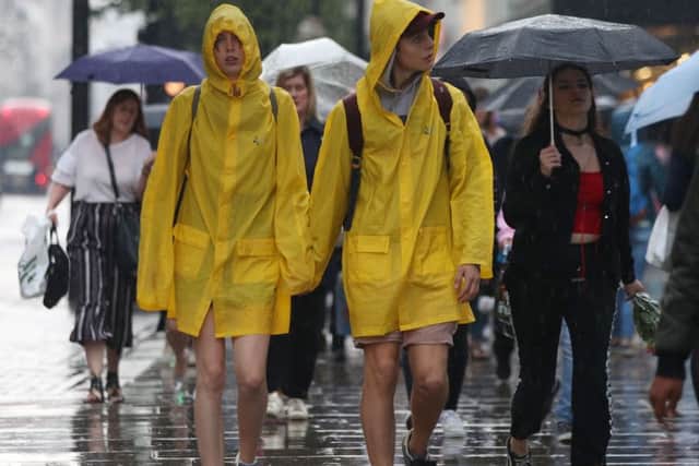 People caught in the rain on Oxford Street, central London on  Tuesday. The wet weather continued in parts of England on Wednesday and is set to come to Northern Ireland on Thursday and Friday. Photo credit should read: Yui Mok/PA Wire