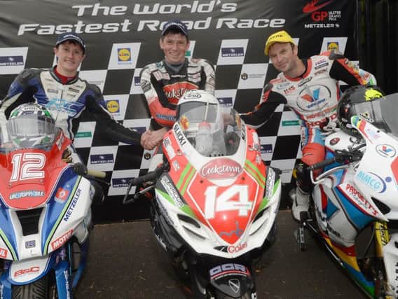Dan Kneen won his maiden international road race at the Ulster Grand Prix in the Superstock event on the Burrows Engineering Racing Suzuki in 2014. He is pictured with runner-up Dean Harrison (left) and Bruce Anstey.