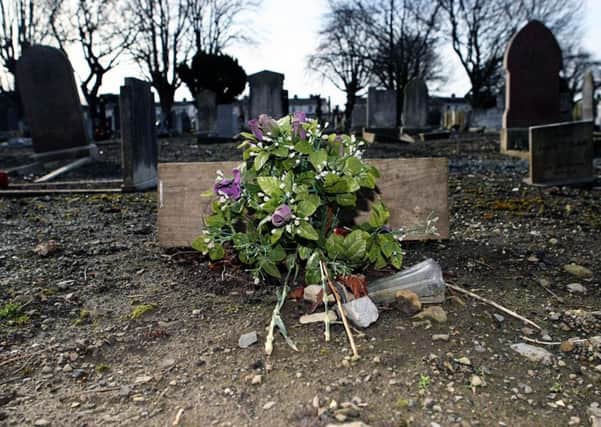 "The abuse was horrendous." A bunch of flowers marks the spot where 40 infants who died in the Bethany mother and baby centre were buried in unmarked graves at Mount Jerome graveyard in Dublin. Photo: Niall Carson/PA Wire