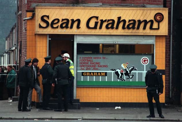 The February 1992 scene of a loyalist attack on Sean Graham bookmakers on Ormeau Road in which five men died