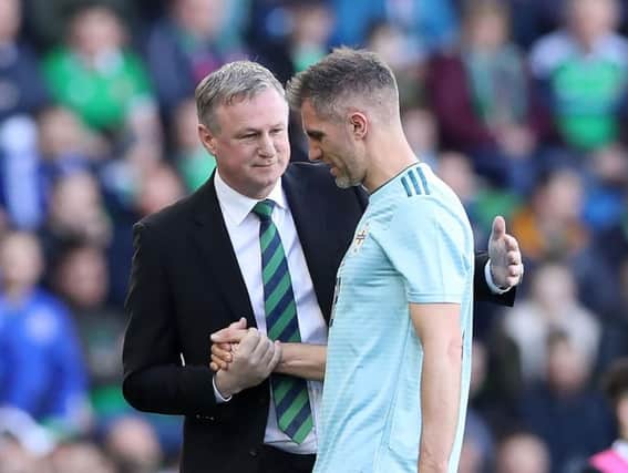 Northern Ireland manager Michael O'Neill with veteran defender Aaron Hughes