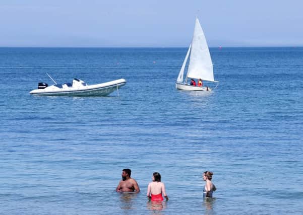 People take advantage of the sunshine at Helen's Bay Co. Down on Sunday. 

Picture by Jonathan Porter/PressEye