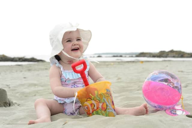 Emily Ava Alexander pictured enjoying the sunny Sunday at Kilclief beach in Co Down.
 Picture by Arthur Allison