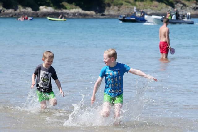 Noah Harte, 8, and his brother Caleb from Belfast have some fun in the water at Helen's Bay beach. 

Picture by Jonathan Porter/PressEye