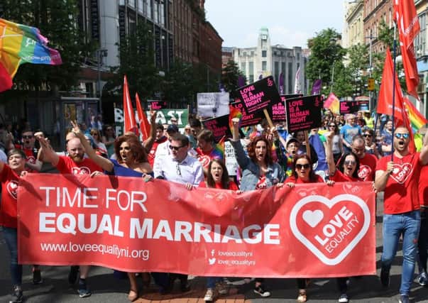 Activists campaigning to legalise same-sex marriage in Northern Ireland take part in a parade through Belfast city centre on 2 June 2018. Photo: Peter Morrison/PA Wire