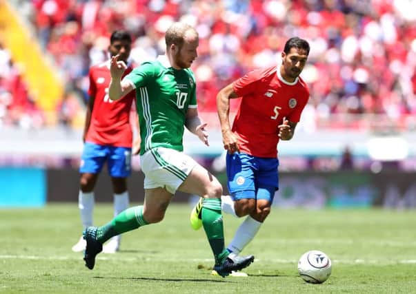 Costa Rica's Ceslo Borges with Northern Ireland's Liam Boyce