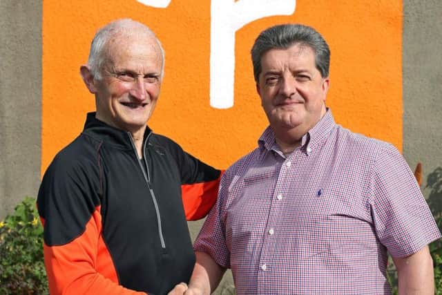 Undated handout photo issued by Northern Ireland Prison Service of their director general Ronnie Armour, with Tommy Fee, 77, who has completed the last of 22 parkruns across Northern Ireland at Magilligan Prison.