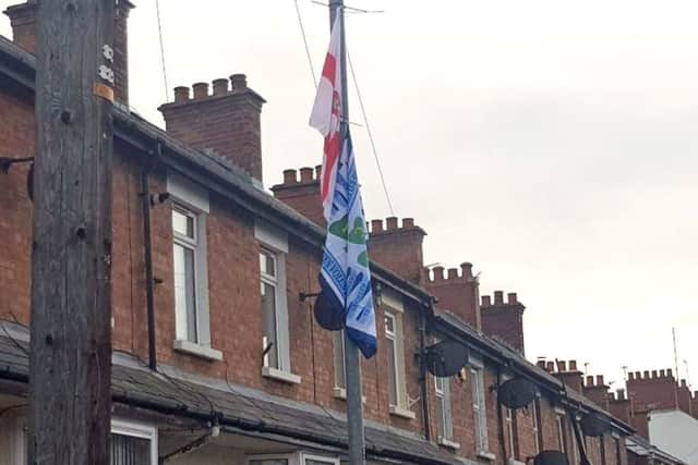 BEST QUALITY AVAILABLE

Handout photo taken with permission from the Twitter feed of M!irtn Ã® Muilleoir, of Union and UVF flags on lamposts off Ravenhill Avenue, which leads to a mixed housing estate in south Belfast the people in the image or facts mentioned in the caption