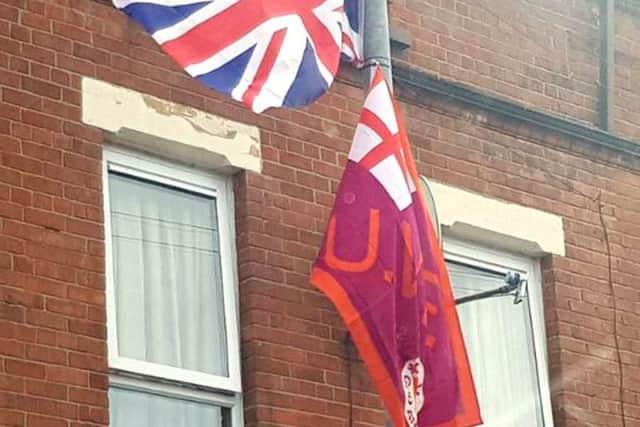 BEST QUALITY AVAILABLE

Handout photo taken with permission from the Twitter feed of M!irtn Ã® Muilleoir, of Union and UVF flags on lamposts off Ravenhill Avenue, which leads to a mixed housing estate in south Belfast
